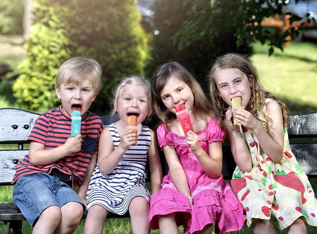 Kids eating frozip popsicles